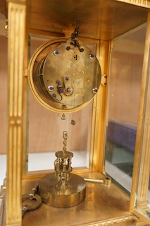 A large 19th century French four glass mantel clock, with key and pendulum, 37cm. Condition - fair to good, not tested